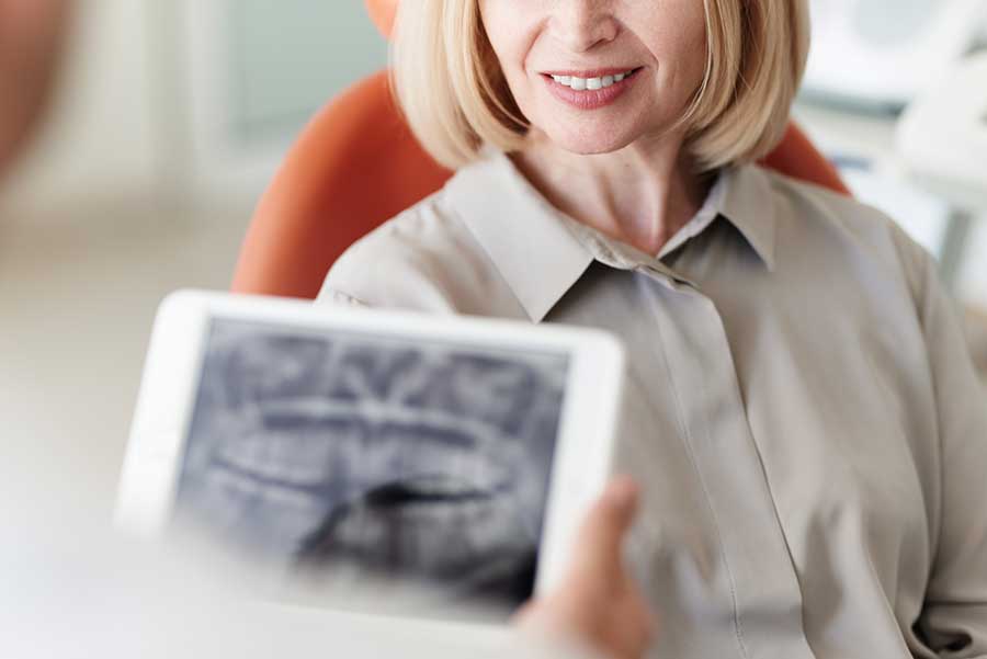 Smiling patient listening to diagnose