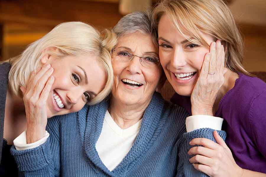 Three Generations Of Women Smiling Together