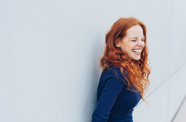 Happy girl smiles at Fairbanks Periodontal Associates